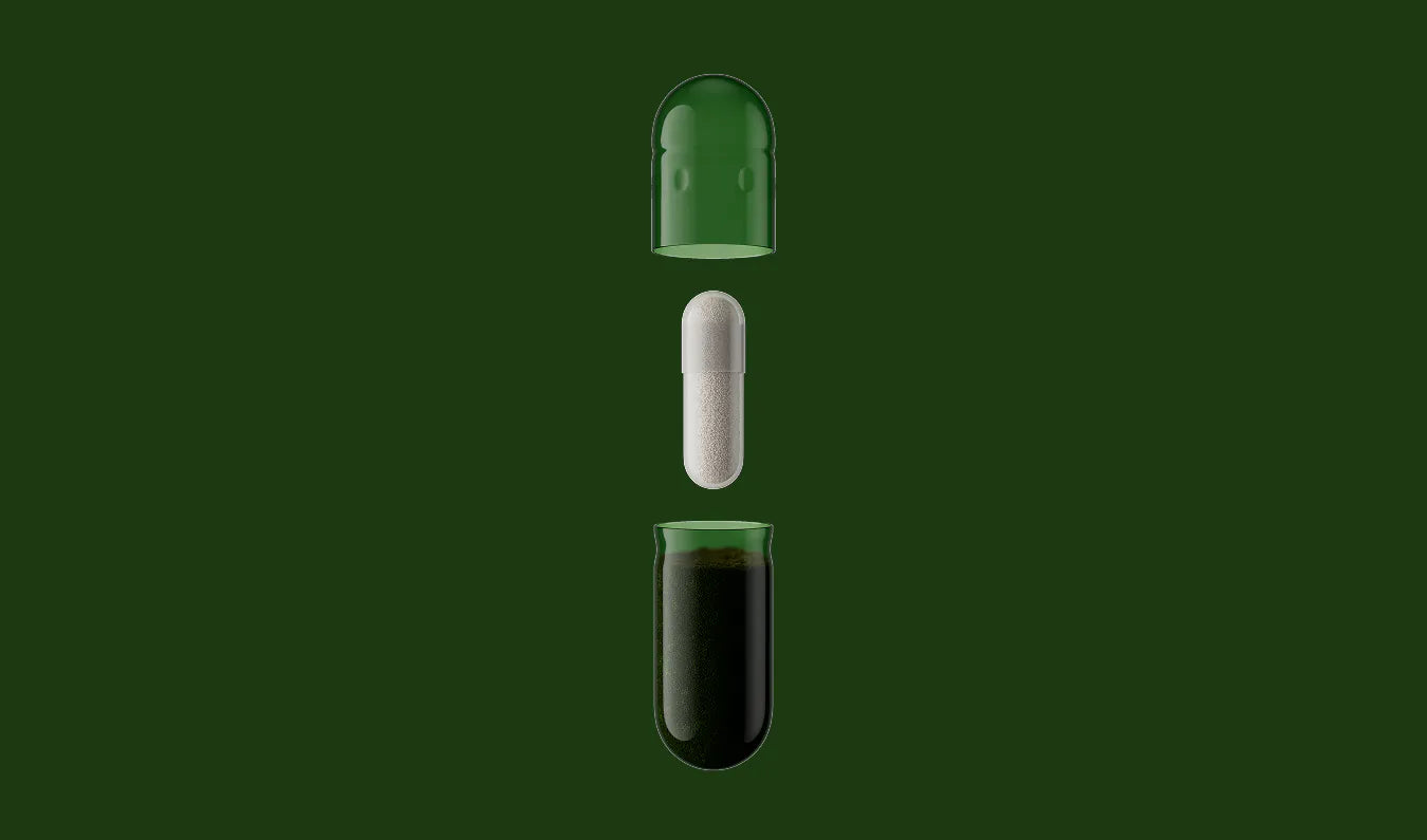 Three capsules with different contents on a green background